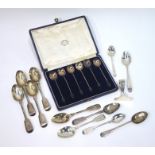 Eleven various Georgian and later teaspoons and an infant's pusher (no spoon) applied with relief