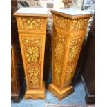 A pair of floral marquetry kingwood and rosewood jardiniere/bust stands with marble tablet tops,