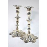 A pair of late George II cast silver baluster candlesticks, the detachable sconces with assay mark
