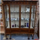 A fine quality Edwardian Sheraton Revival inlaid mahogany display cabinet, the arcaded frieze over a