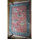 A fine Persian silk Quom hunting design rug, second half 20th century, the dark coral ground with