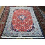 A fine Persian Bidjar rug, the central navy medallion on red ground filled with small stylised