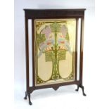 A late 19th century mahogany framed fire screen with a fine Art Nouveau hand-worked silk
