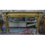 A 19th century carved giltwood and composite framed landscape overmantle, with original mirrored