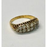 An 18ct yellow gold two row diamond cluster ring with fourteen graduated old cut diamonds, size M,