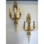 A good set of four ormolu three branch wall sconces in the Adam Revival style, each mounted with two