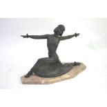 A 1930's vintage Art Deco spelter figure of an exotic dancing girl in flared skirt, on marble