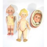 Two small bisque dolls, a doll's face and two miniature china doll's dolls (5)