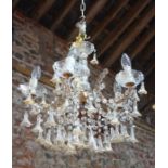 An Italian glass Murano style hanging electrolier, the five scroll arms with gilt highlights and