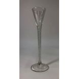 A Georgian style tall cordial glass, drawn conical bowl, multi opaque and air twist spiral stem,