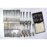 A good quality set of German Art Nouveau electroplated table knives, forks and spoons for twelve