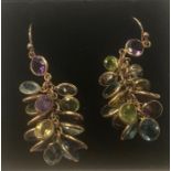 A pair of 9ct rose gold hanging earrings formed of small oval drops of citrine, amethyst,