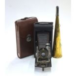 A Kodak no. 3-A Autographic model C folding camera with leather case, to/w a brass conical