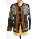 A traditional vintage Norwegian wool jacket with silvered clasps in black/cream/red/green colour-way