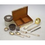 Various silver items including cigarette box, sifter ladle and other flatware, silver propelling