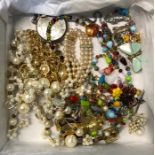 A collection of costume jewellery including Monet gilt metal and pearl necklace, large enamel and