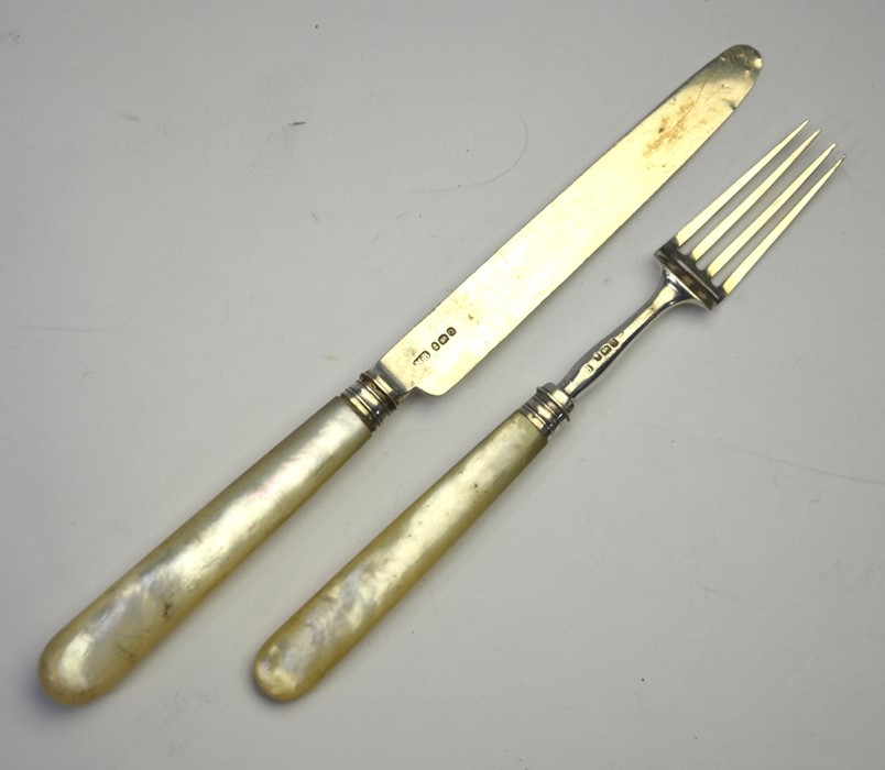 A George III silver dessert knife and fork with mother of pearl handles, Moses Brent, London 1811