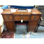 A Regency inlaid cross-banded mahogany breakfront pedestal sideboard, comprised of three drawers