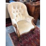 Victorian walnut framed button upholstered armchair