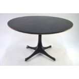 George Nelson for Vitra, a circular occasional table, the black top raised on a black base, bears