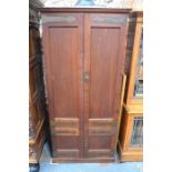 A Regency rosewood library cabinet, the upper part with pair of arched glazed in doors over two