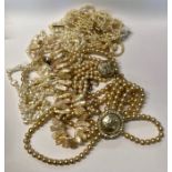 A collection of pearl necklaces including a six row baroque freshwater pearl necklace with