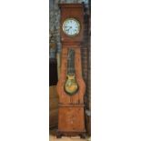 A continental polychrome decorated (faded) pine long case comtoise clock, the circular enamelled