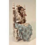 A Lladro figure of a young Spanish girl seated on an ornate chair holding a posy of roses,