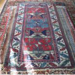 Early 20th century Anatolian rug, navy ground with three rectangular medallions and ivory border