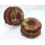 A pair of Victorian mahogany circular gout stools with overstuffed needlepoint covers, 31 cm dia.