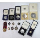 Seven various 1930s cased silver rifle-shooting medallions, to/w seven other uncased examples,