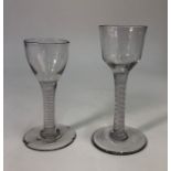 An antique cordial glass, ogee bowl, double spiral opaque and lace twist stem, domed foot and