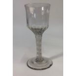 An antique wine glass, large ogee moulded bowl, double spiral opaque twist stem, conical base and