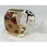 Royal Crown Derby Imari decorated paperweight in the form of an elephant, silver stopper, 10 cm