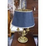 A good quality brass three candle reading lamp with additional rise and fall twin bulb