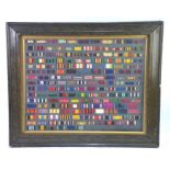 A collection of British military medal ribbons, mounted within a glazed frame