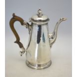 A George II silver coffee pot of plain tapering form, the domed cover with compressed ball knop