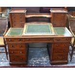 A late 19th  century mahogany twin pedestal desk, the top with raised superstructure of drawers