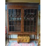 A George III mahogany astragal glazed bookcase cabinet with pair of gothic style doors, raised on