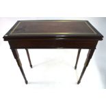 A George III brass and ebony banded mahogany card table, the fold over top revealing a baize lined