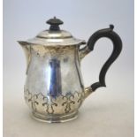 A heavy quality silver chocolate pot on the Carolean manner with embossed decoration and moulded