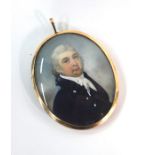 A fine quality Georgian oval portrait miniature on ivory of a gentleman with grey wig, white stock