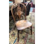 A set of four elm seat wheelback chairs with crinoline stretchers (4)