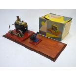 A Mamod SE1 Stationery Steam Engine, mounted on board with Grinding Machine c/w original boxes