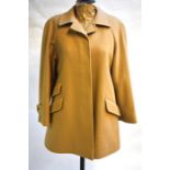 A lady's Aquascutum camel wool jacket with pockets to front and concealed button fastening, 54 cm