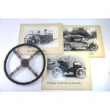 A vintage steering wheel with rubber grip, four wired spokes and MG badge to hub, 44cm diameter,