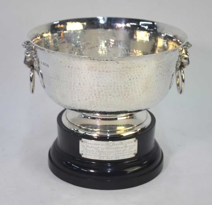 A planished silver rose-bowl with lion mask and ring handles, on flared foot rim, Edward Barnard &
