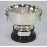 A planished silver rose-bowl with lion mask and ring handles, on flared foot rim, Edward Barnard &