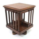 An old oak table top revolving bookcase, 30 cm x 30 cm x 39 cm h