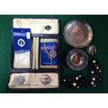 A small jewel box containing oval agate brooch, beads, and two silver trinket dishes